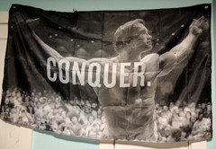 Wall Banner Art Conquer 59″ x 35″ Grey Tones College Dorm Teen