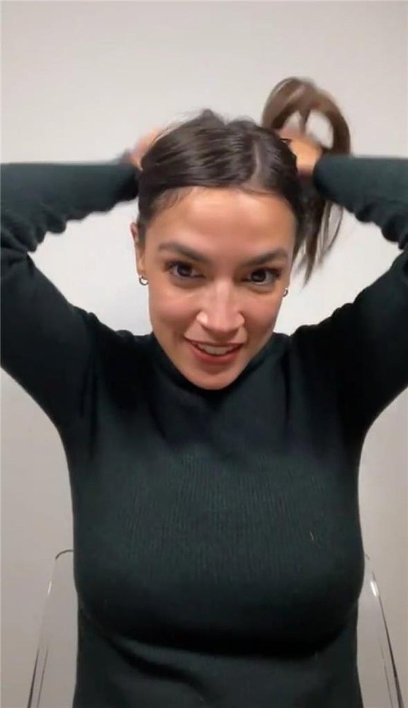 ALEXANDRIA OCASIO CORTEZ AOC TYING HAIR GLOSSY POSTER PICTURE PHOTO PRINT ny 386