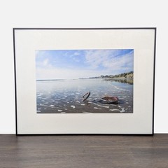 Framed Print – Abandoned Bicycle Wheel on Beach