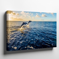 Serene Ocean Scene At Sunrise Featuring Two Playful Dolphins Leaping Wall Art