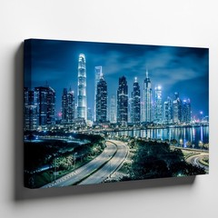 Stunning Nighttime Cityscape Featuring A Modern Skyline Dominated By Wall Art