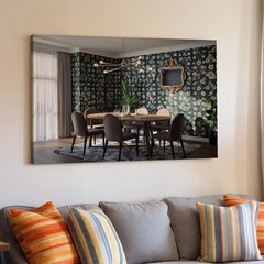 Stylish Contemporary Dining Room Featuring A Round Table Surrounded By Wall Art